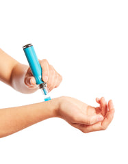 The Genteel Lancing Device in action on a wrist